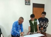 Kadis PMD Kotamobagu dan UBMG Melakukan Penanda Tanganan Perjanjian Kerja Sama.