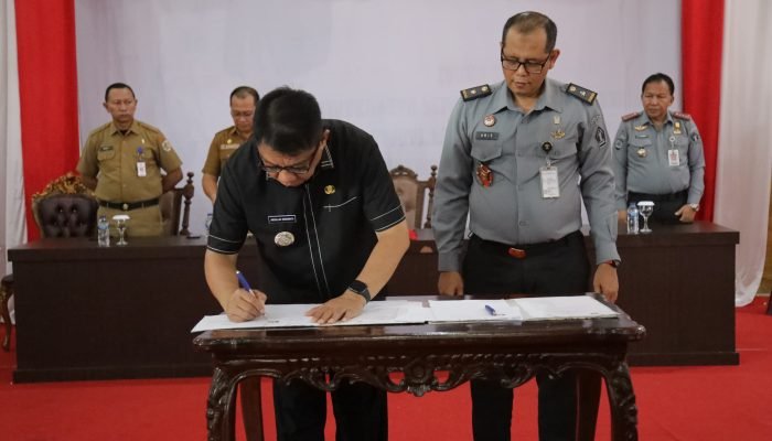 Abdullah Mokoginta Tandatangani Nota Kesepakatan dan Rencana Kerja Antara Pemerintah Daerah Kota Kotamobagu Dengan KemenkumHAM.