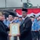 Kadis Perikanan Kota Bitung Sadat Minabari Terima Tanda Kehormatan Satyalancana Wira Karya dari Presiden