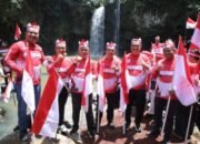 Pemkab Asahan Kibarkan Ratusan Bendera Merah Putih di Air Terjun Simonang – Monang